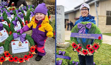 A young female arm amputee holds a Remembrance Day wreath. A teenaged male arm amputee holds a War Amps wreath at a war memorial.